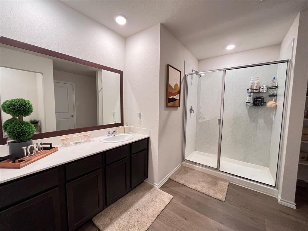1415 Bent Spur Drive Denton, TX 76207 - Photo 11 of 26 a bathroom with a double vanity sink mirror and shower