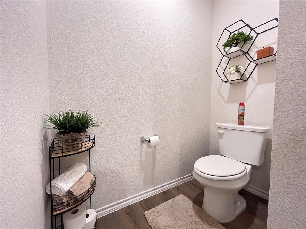 1415 Bent Spur Drive Denton, TX 76207 - Photo 13 of 26 a bathroom with a toilet and a sink