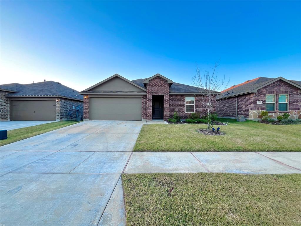 1415 Bent Spur Drive Denton, TX 76207 - Photo 25 of 26 a front view of a house with a yard