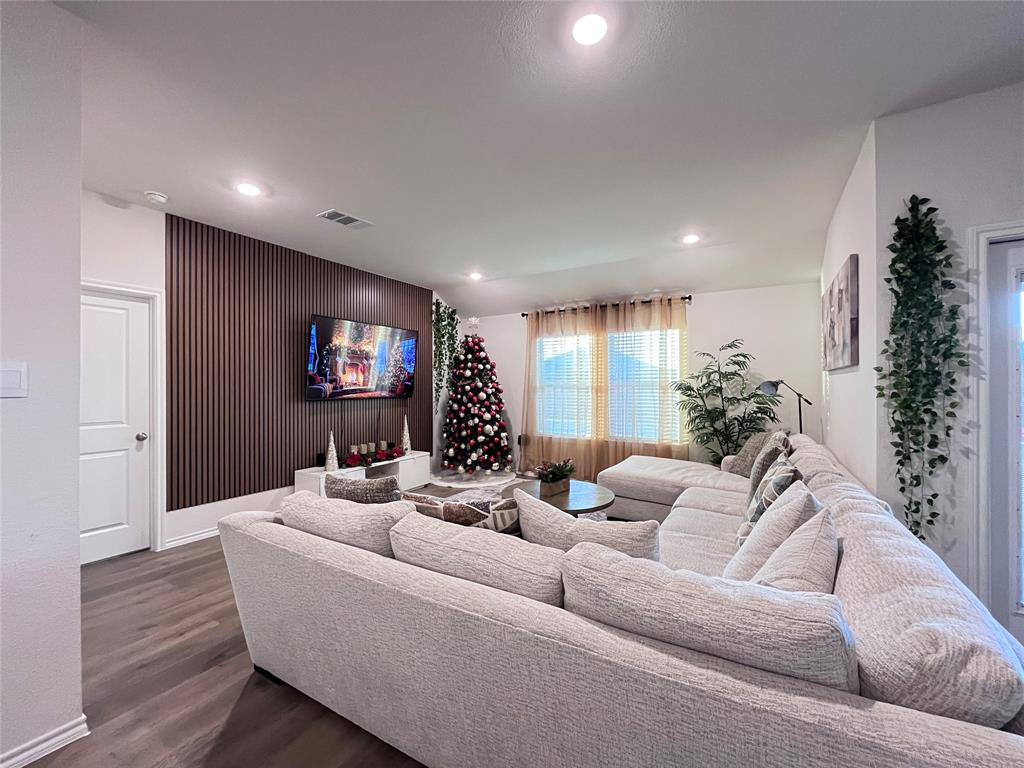 1415 Bent Spur Drive Denton, TX 76207 - Photo 7 of 26 a living room with furniture and a flat screen tv