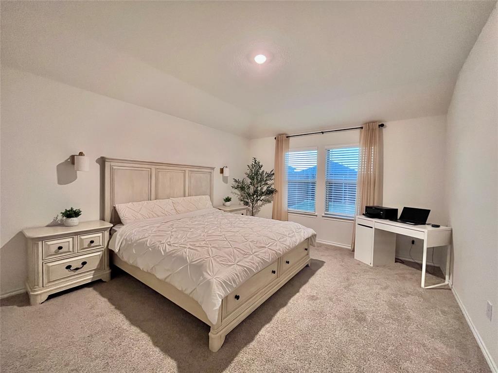 1415 Bent Spur Drive Denton, TX 76207 - Photo 9 of 26 a bedroom with a bed and a desk