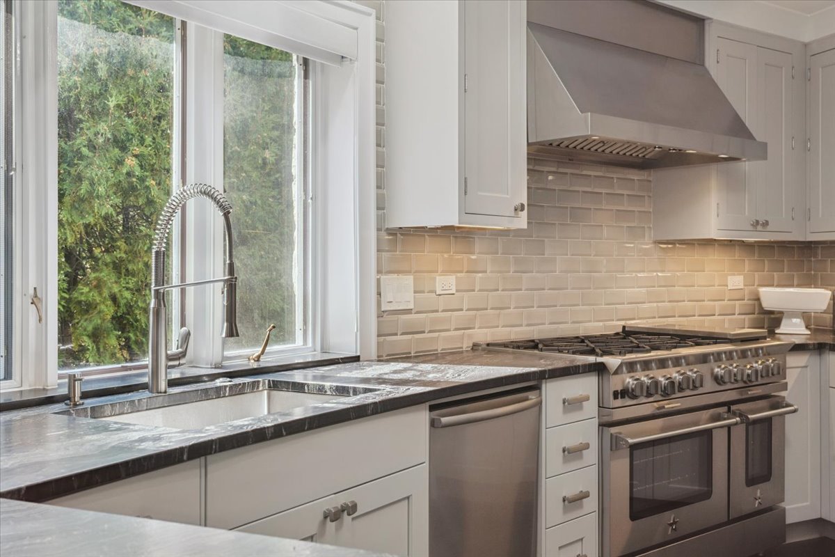 331 Sheridan Road Winnetka, IL 60093 - Photo 17 of 82 a kitchen with a sink stove and cabinets