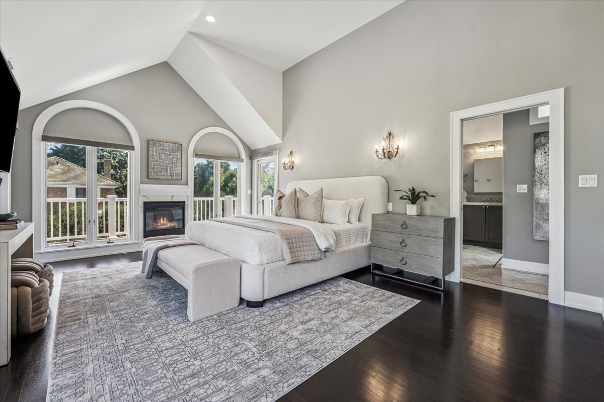 331 Sheridan Road Winnetka, IL 60093 - Photo 39 of 82 a spacious bedroom with a balcony a bed and wooden floor