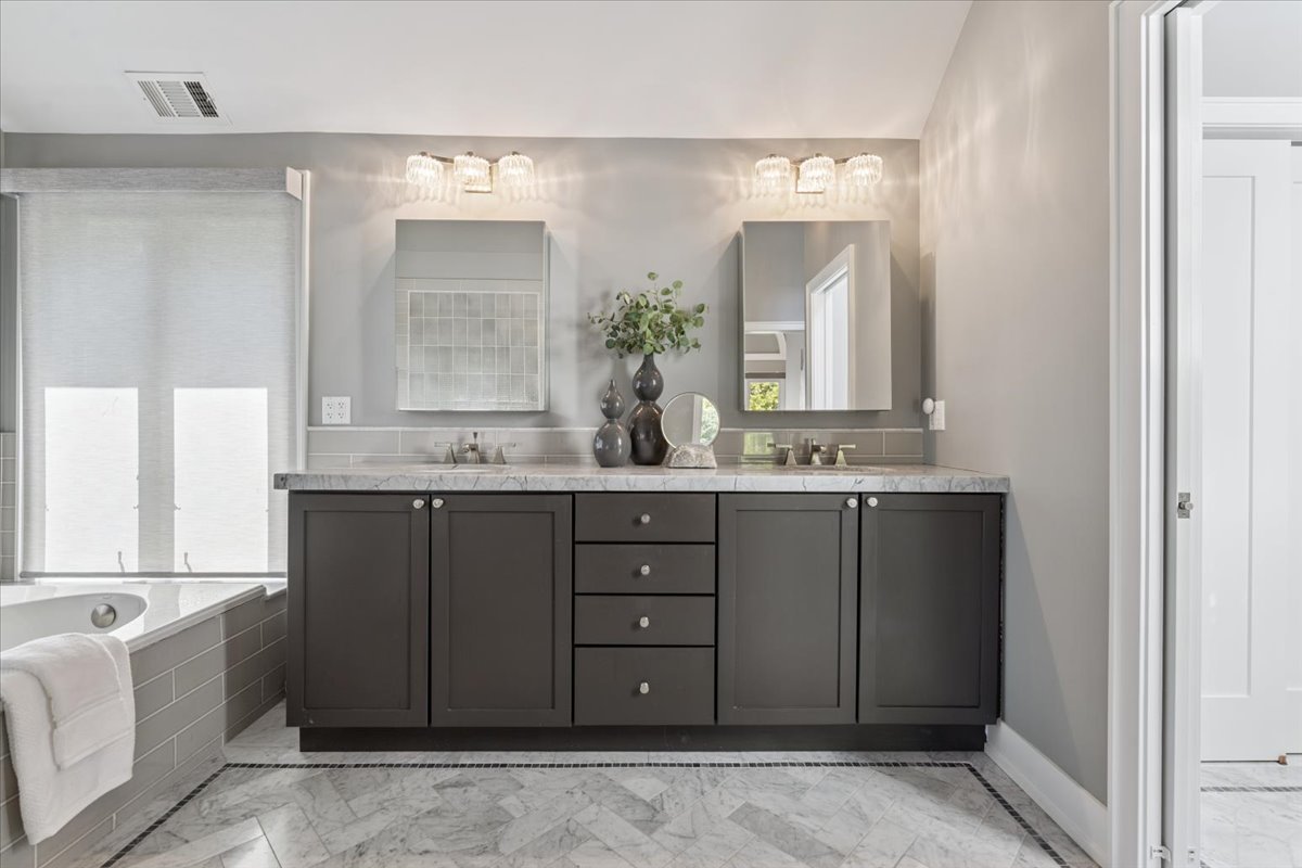 331 Sheridan Road Winnetka, IL 60093 - Photo 49 of 82 a bathroom with a granite countertop double vanity sink and mirror