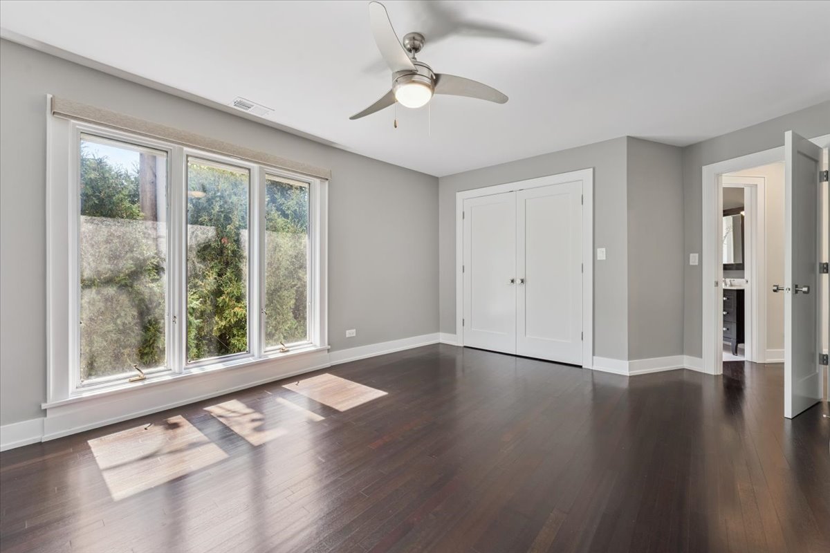 331 Sheridan Road Winnetka, IL 60093 - Photo 52 of 82 a view of an empty room with wooden floor and a window