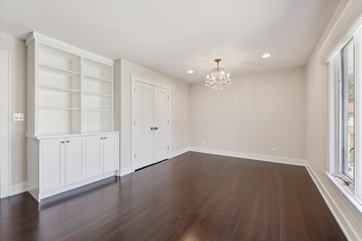 331 Sheridan Road Winnetka, IL 60093 - Photo 55 of 82 an empty room with wooden floor and windows