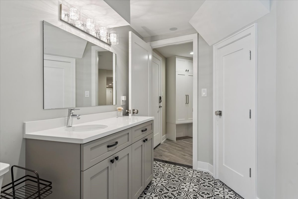 331 Sheridan Road Winnetka, IL 60093 - Photo 71 of 82 a bathroom with a sink and a mirror