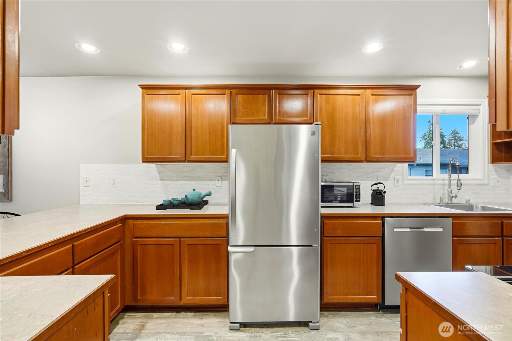 7809 218th Street Southwest, Unit 12 Edmonds, WA 98026 - Photo 13 of 34 a white refrigerator freezer sitting in a kitchen
