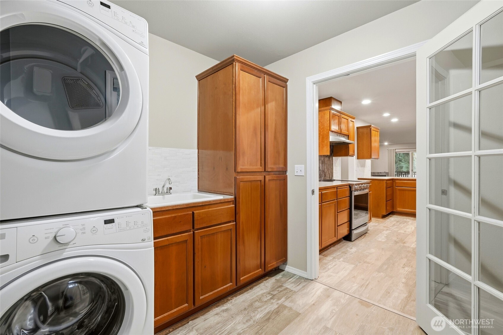 7809 218th Street Southwest, Unit 12 Edmonds, WA 98026 - Photo 17 of 34 a view of a kitchen with washer and dryer