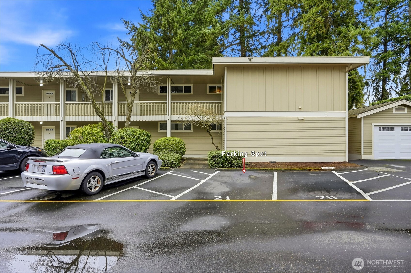 7809 218th Street Southwest, Unit 12 Edmonds, WA 98026 - Photo 24 of 34 a front view of a house with parking area