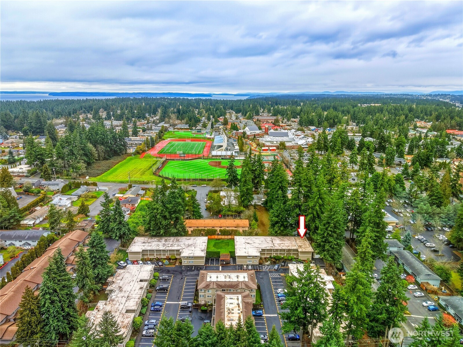 7809 218th Street Southwest, Unit 12 Edmonds, WA 98026 - Photo 29 of 34 an aerial view of a city with lots of residential buildings ocean and mountain view in back