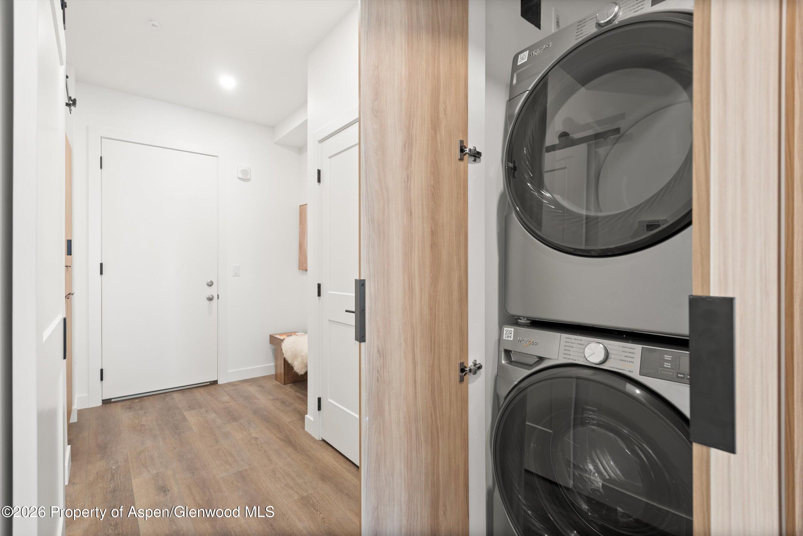140 Basalt Center Circle, Unit 323 Basalt, CO 81621 - Photo 4 of 25 a view of a hallway with washer and dryer