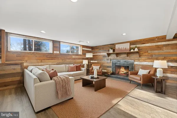 a view of a livingroom with an empty space and a fireplace