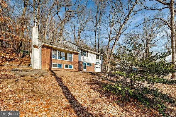 a big house with bunch of trees