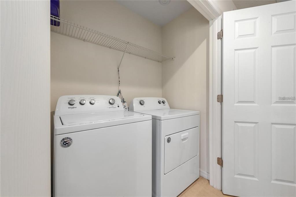 2449 Varenna Loop Kissimmee, FL 34741 - Photo 16 of 25 a utility room with dryer and washer