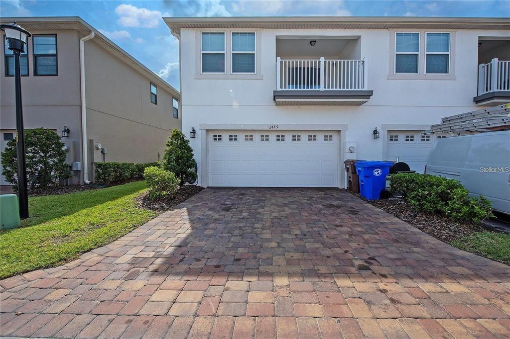 2449 Varenna Loop Kissimmee, FL 34741 - Photo 18 of 25 a view of a house with a yard