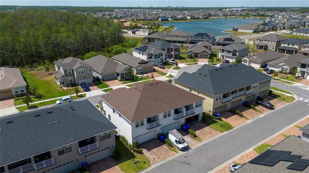 2449 Varenna Loop Kissimmee, FL 34741 - Photo 20 of 25 an aerial view of a house with a lake view