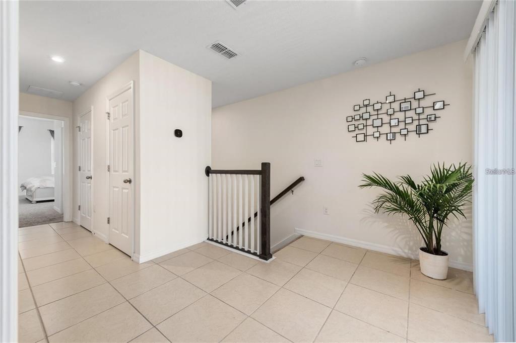 2449 Varenna Loop Kissimmee, FL 34741 - Photo 9 of 25 a view of entryway with wooden floor