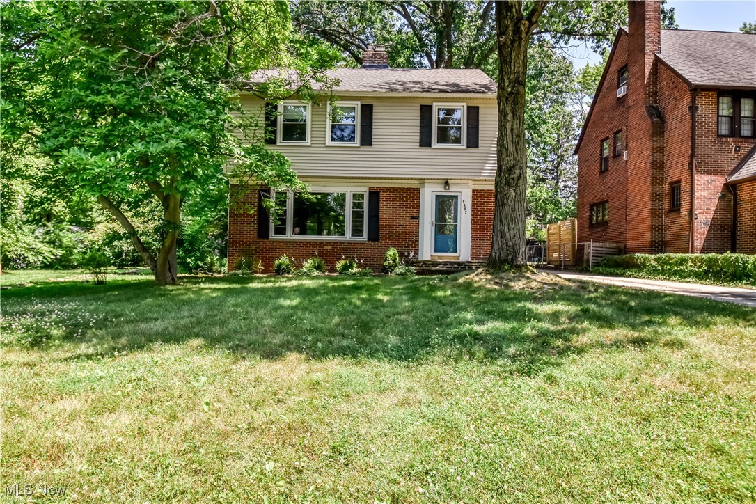 2607 Ashurst Road University Heights, OH 44118 - Photo 2 of 39 Colonial inspired home featuring a front yard, a chimney, and brick siding