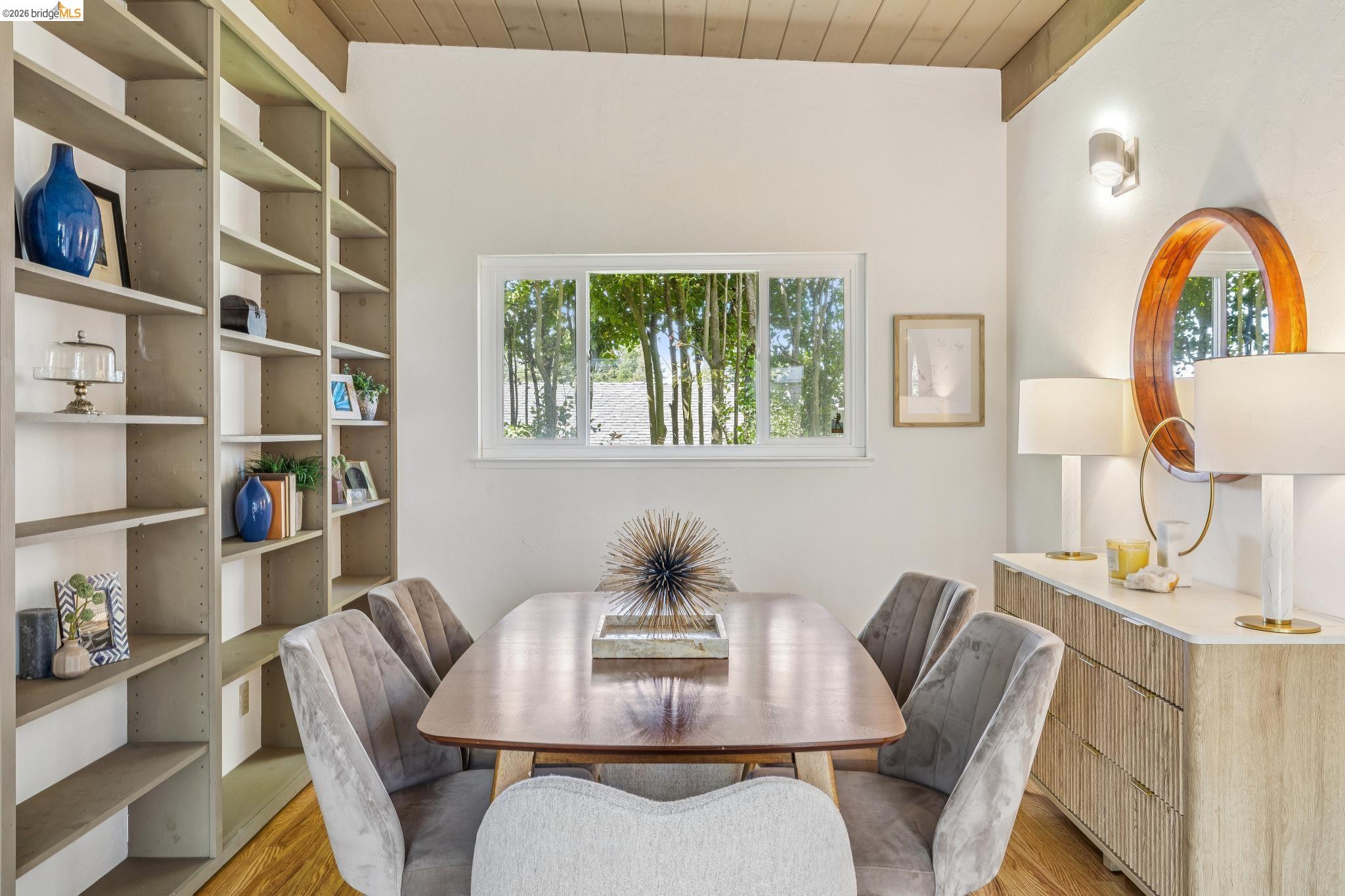 1024 Overlook Road Berkeley, CA 94708 - Photo 26 of 41 Built-in shelving, wood-finish flooring, recessed window, wood-paneled ceiling, wall-mounted light fixture