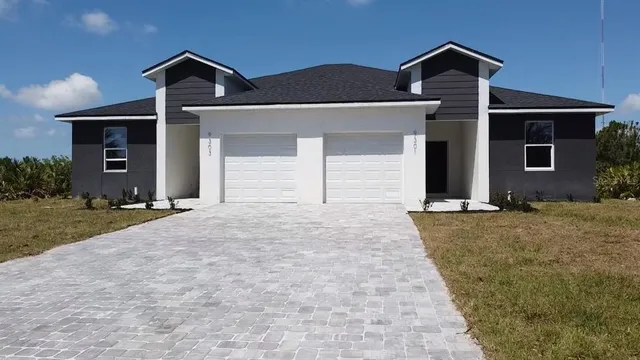 front view of a house with a yard