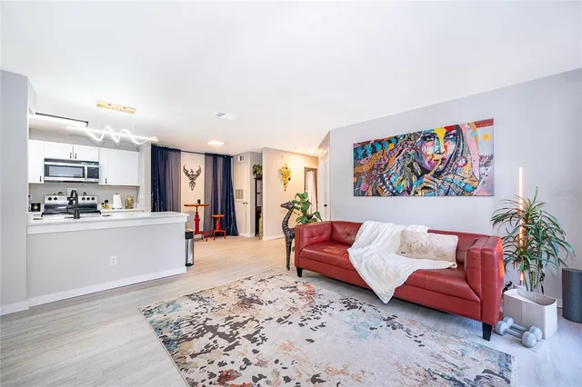 a large living room with furniture and a rug