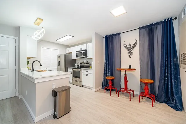 a view of kitchen and sink