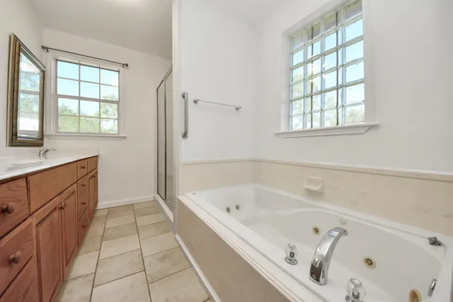 a bathroom with a bathtub and a sink