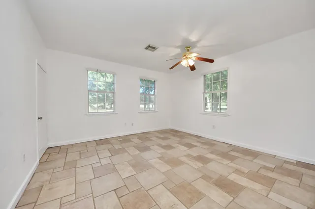 a view of an empty room with a window