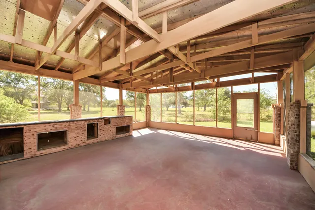 a view of an empty room with windows