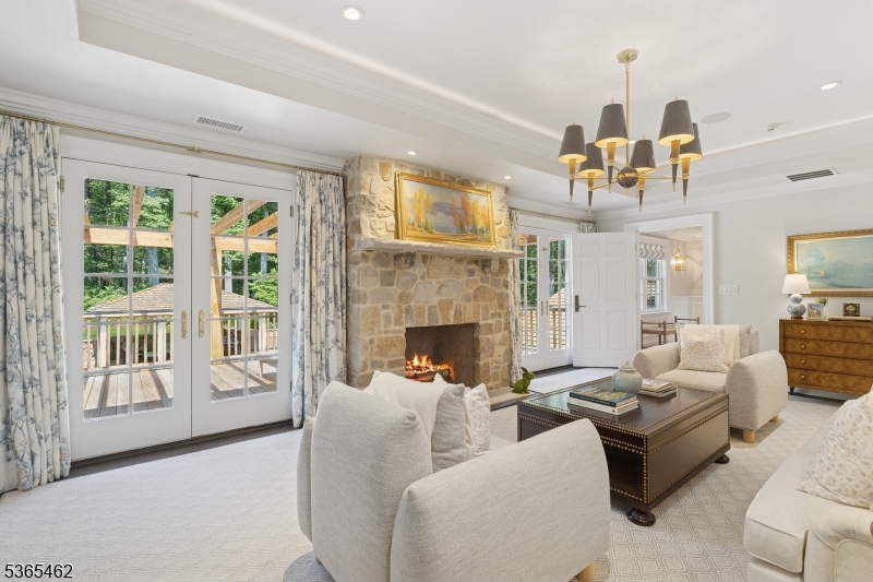 119 Mosle Road Far Hills, NJ 07931 - Photo 18 of 50 a living room with furniture fireplace and a large window