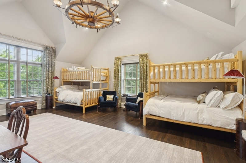 119 Mosle Road Far Hills, NJ 07931 - Photo 28 of 50 a bedroom with a bed a couch and large window