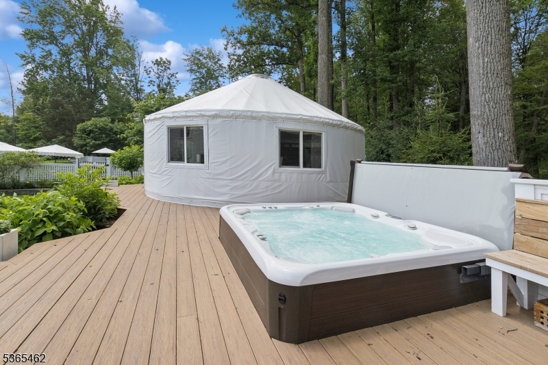 119 Mosle Road Far Hills, NJ 07931 - Photo 40 of 50 a terrace of a house with wooden floor and outdoor seating