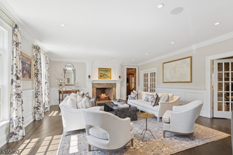 119 Mosle Road Far Hills, NJ 07931 - Photo 5 of 50 a living room with furniture a fireplace and a table