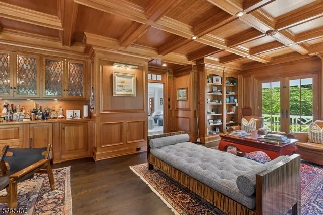 a living room with a bed and furniture