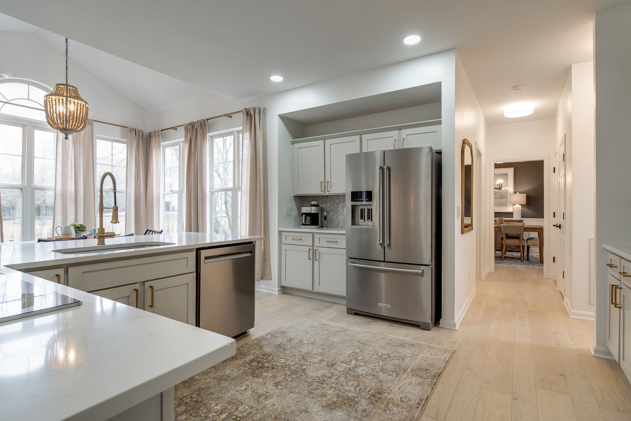 134 Stanwick Drive Franklin, TN 37067 - Photo 12 of 46 a kitchen with stainless steel appliances granite countertop a refrigerator a sink a stove and white cabinets