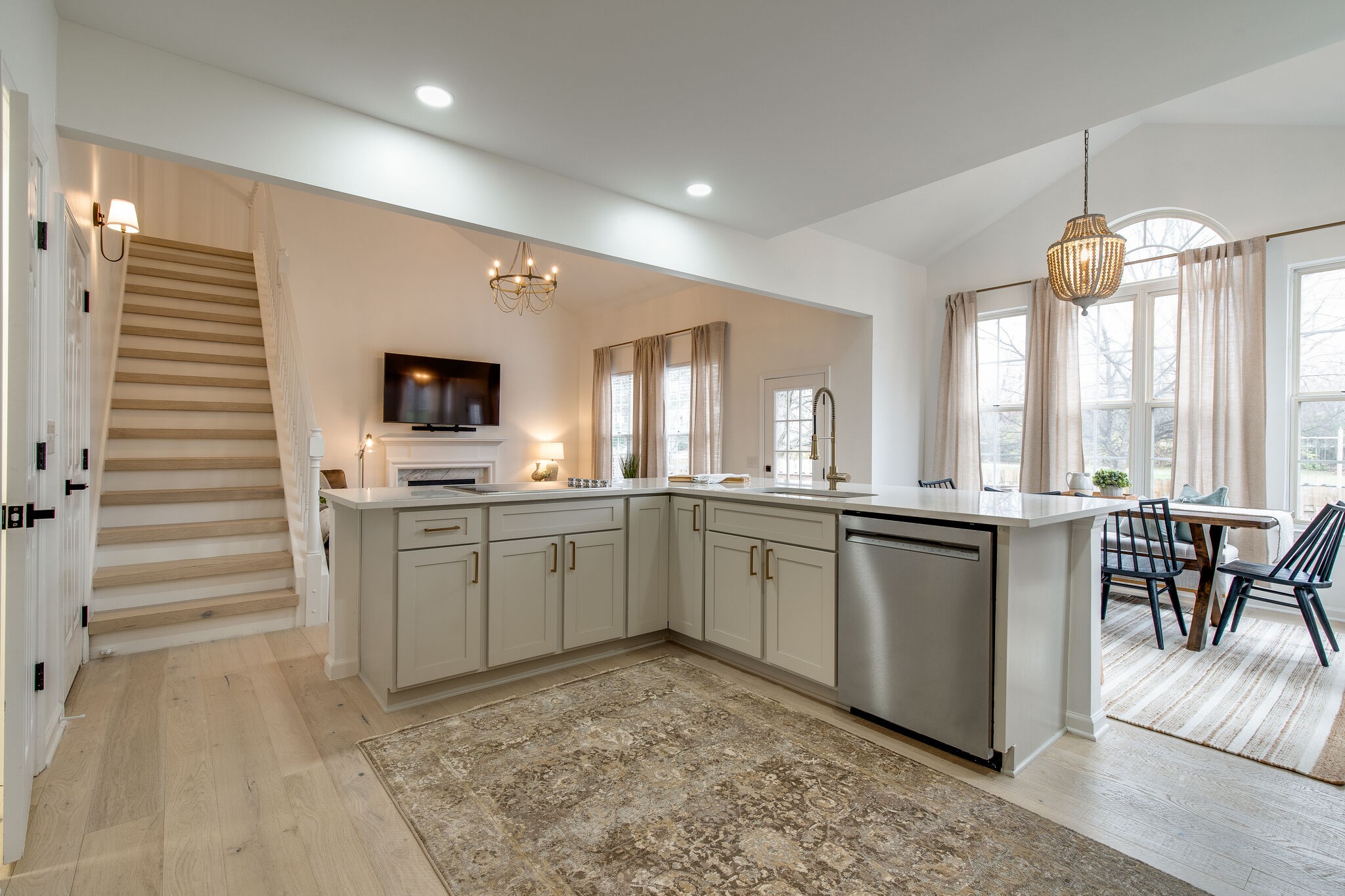 134 Stanwick Drive Franklin, TN 37067 - Photo 20 of 46 a large white kitchen with granite countertop a sink and dishwasher a stove with wooden floor