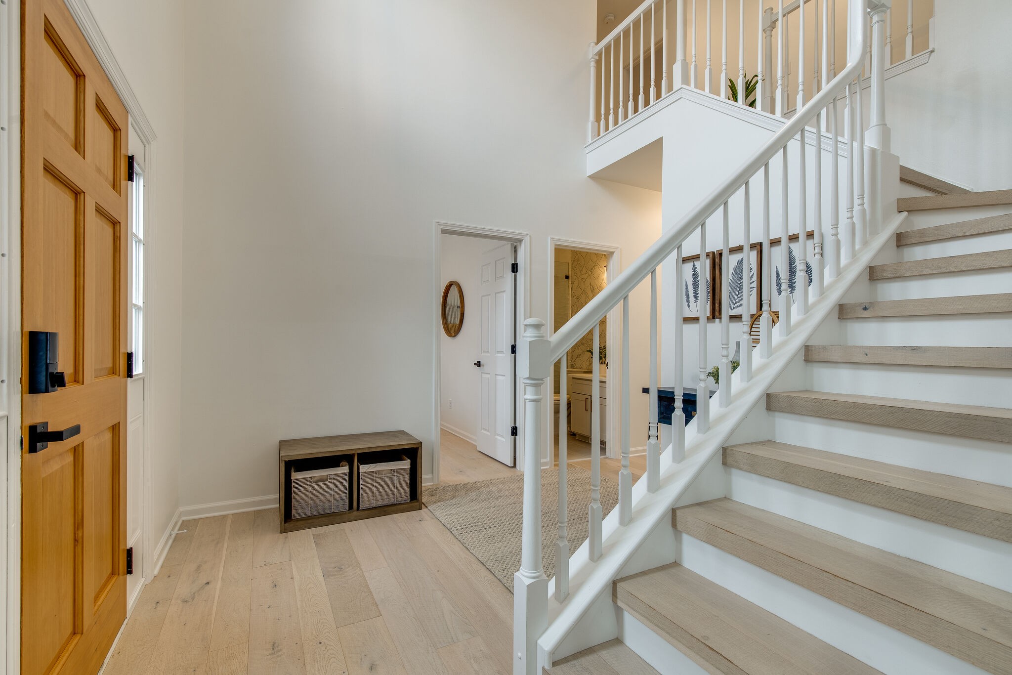 134 Stanwick Drive Franklin, TN 37067 - Photo 2 of 46 a view of staircase with lots of frames on wall and a window