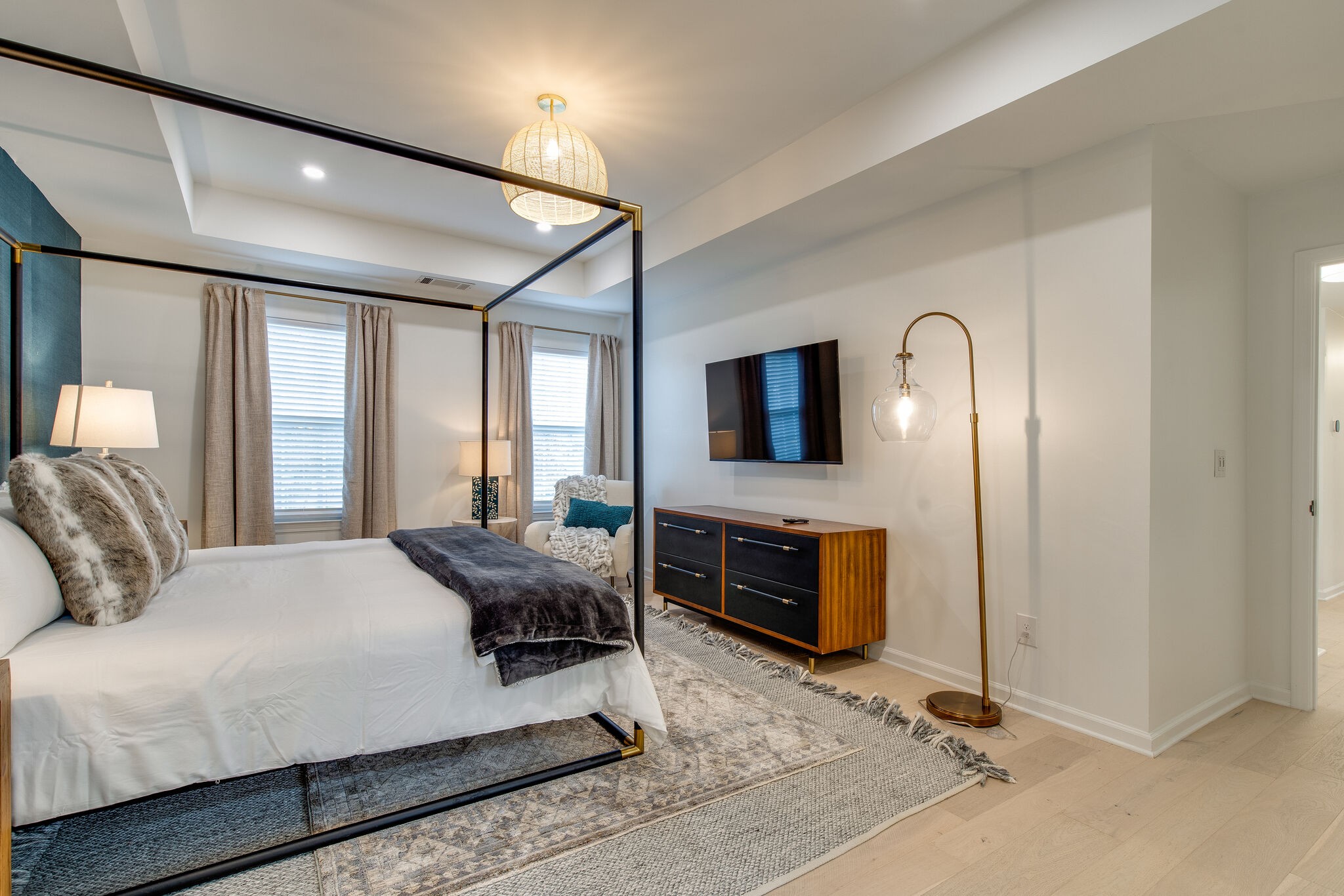 134 Stanwick Drive Franklin, TN 37067 - Photo 21 of 46 a bedroom with a bed flat screen tv and windows