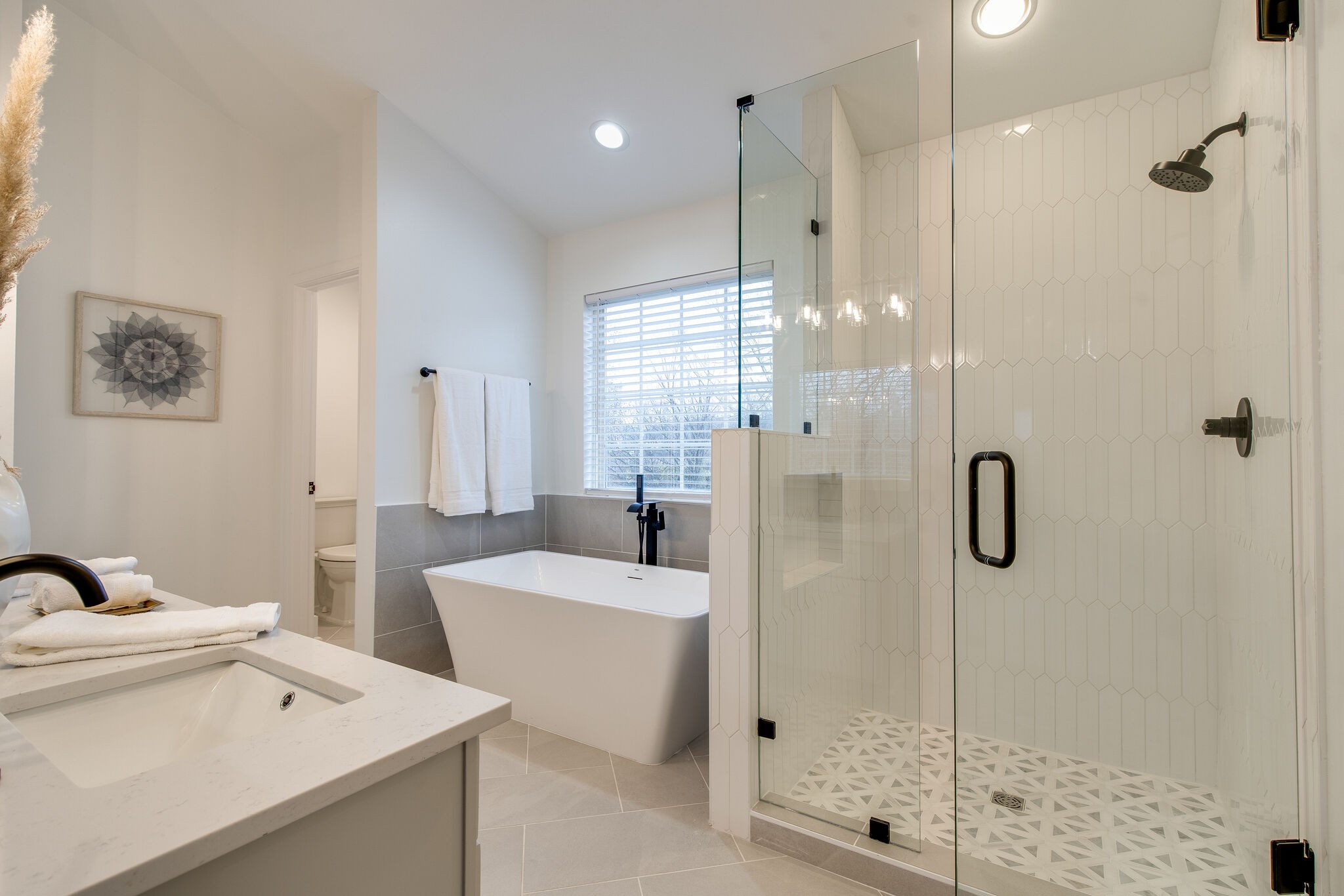 134 Stanwick Drive Franklin, TN 37067 - Photo 23 of 46 a bathroom with a double vanity sink mirror and shower
