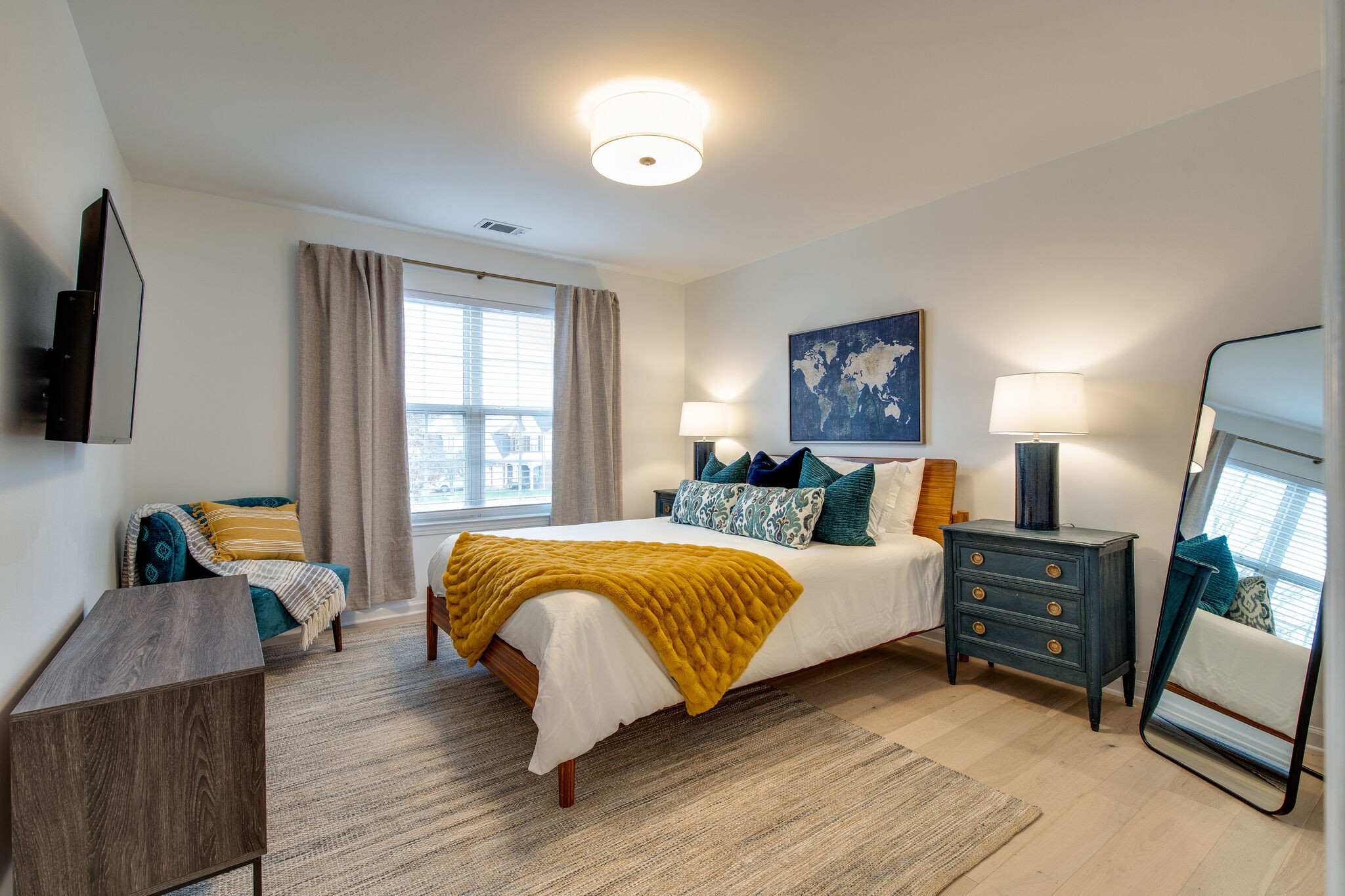 134 Stanwick Drive Franklin, TN 37067 - Photo 33 of 46 a bedroom with a bed a flat screen tv and dresser