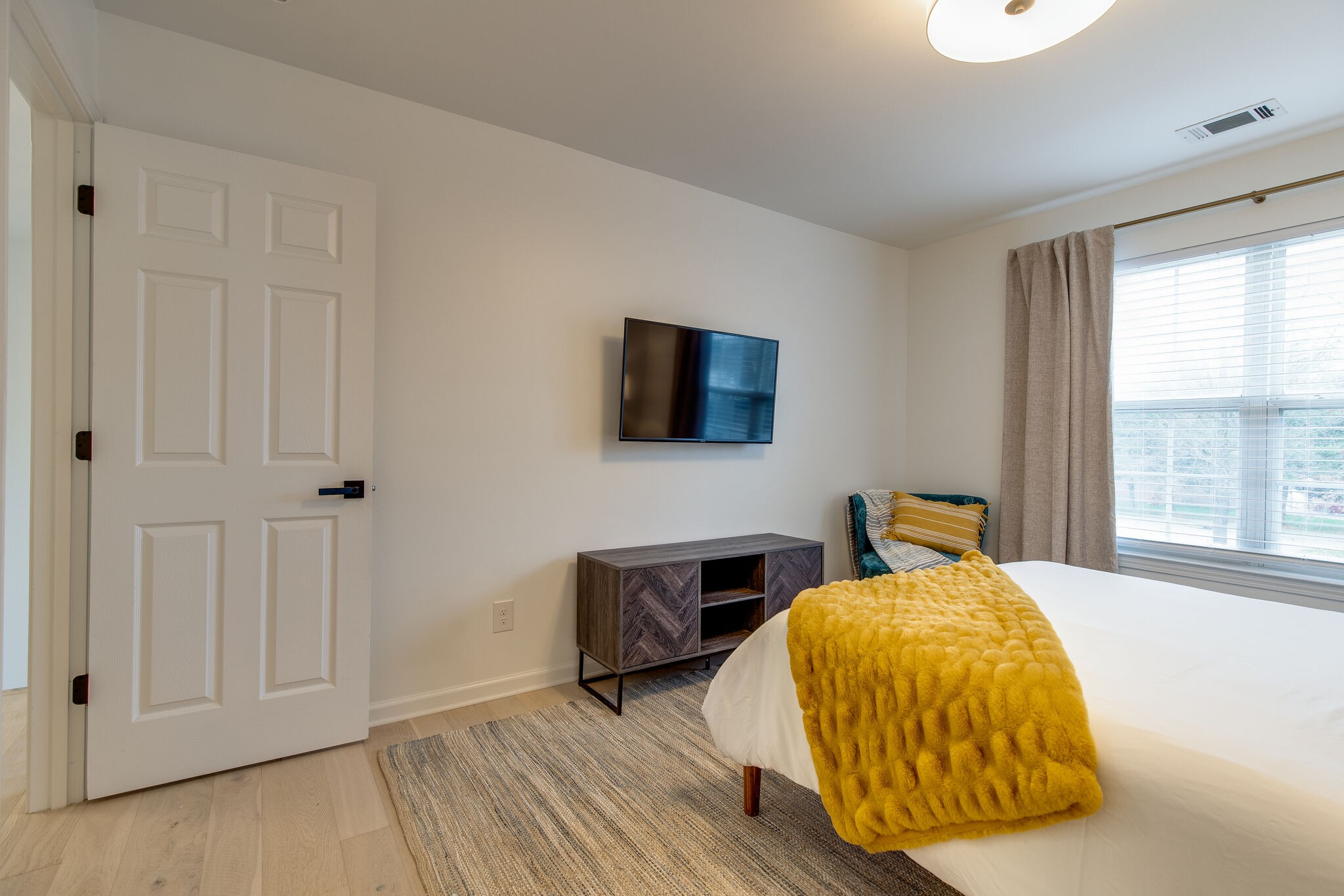 134 Stanwick Drive Franklin, TN 37067 - Photo 34 of 46 a bedroom with a bed and wooden floor