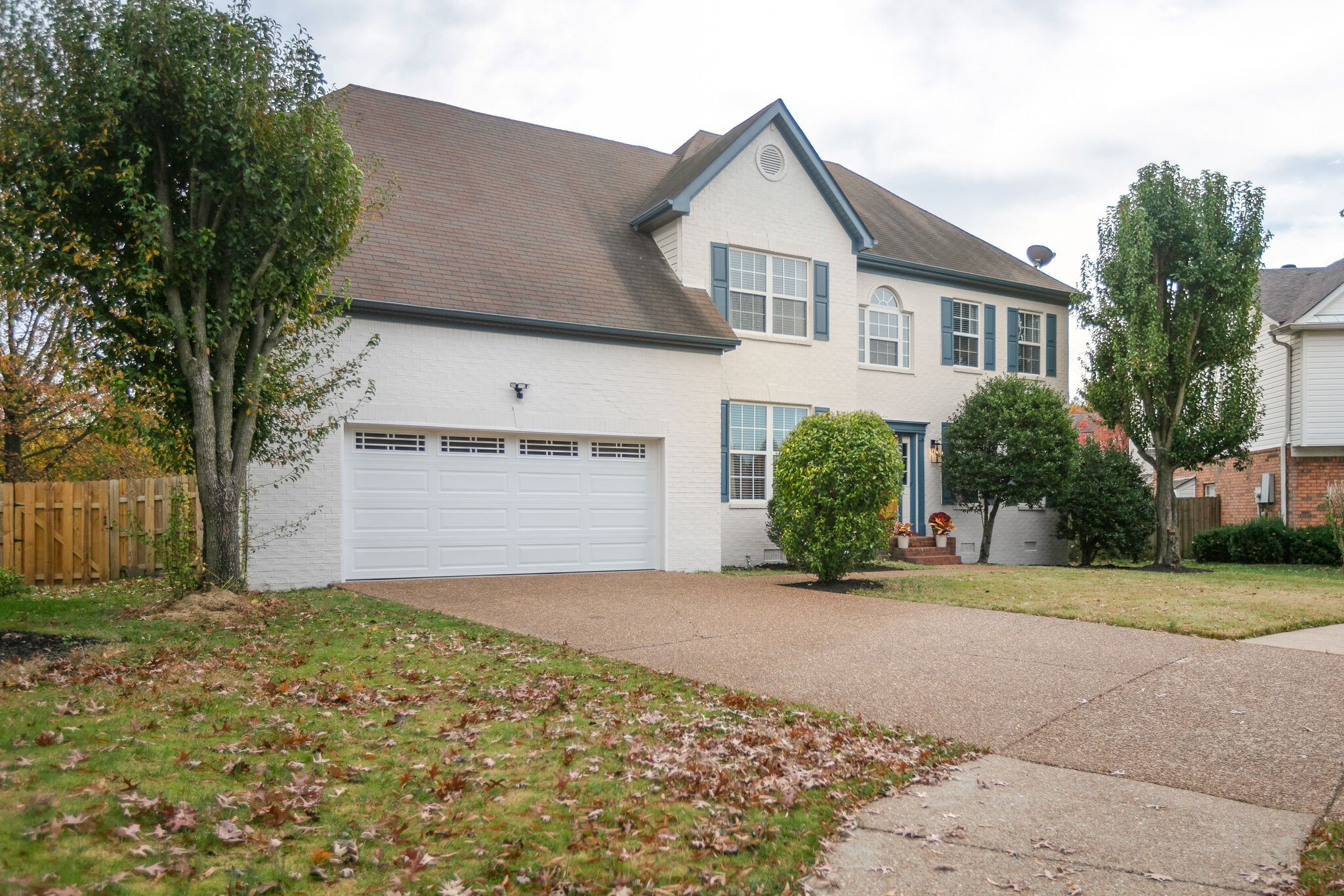 134 Stanwick Drive Franklin, TN 37067 - Photo 38 of 46 a front view of a house with a yard and garage