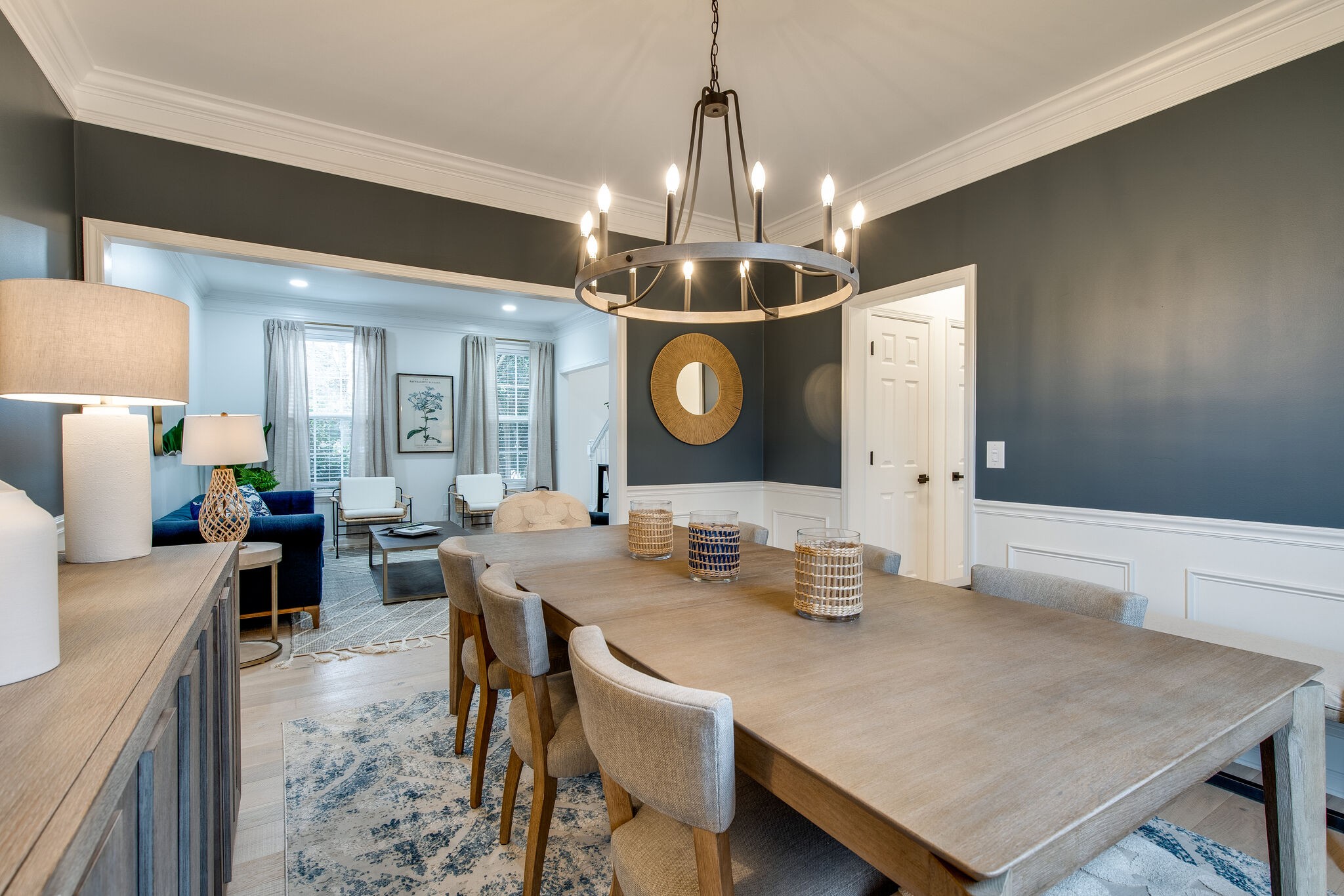 134 Stanwick Drive Franklin, TN 37067 - Photo 7 of 46 a dining room with granite countertop a table chairs and a chandelier