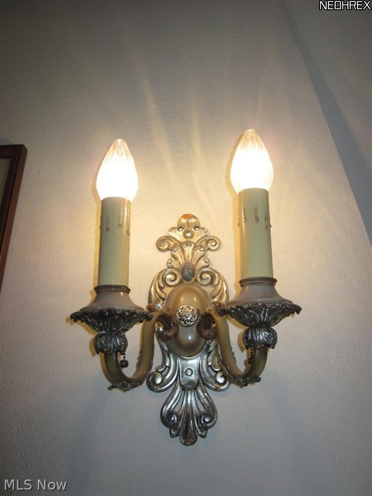 3344 Elsmere Road Cleveland, OH 44120 - Photo 10 of 25 Detailed view of an original sconce above the fireplace