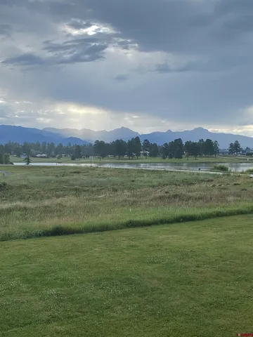 a view of an ocean and a mountain