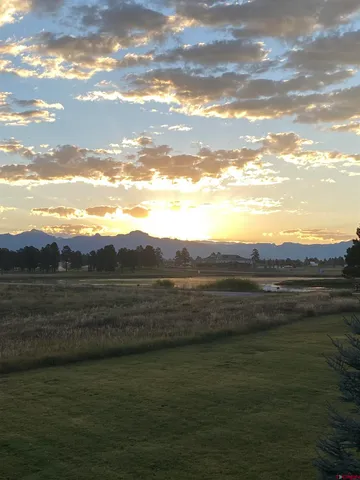 a view of an ocean and mountain