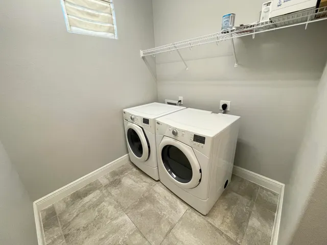 a view of a house with porch and furniture