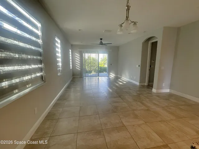 a view of a hallway with windows