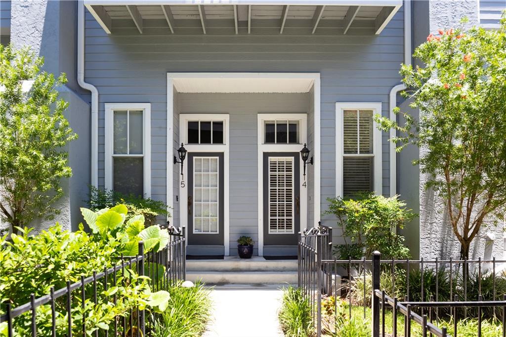 919 South Rome Avenue, Unit 14 Tampa, FL 33606 - Photo 1 of 1 a front view of a house with potted plants